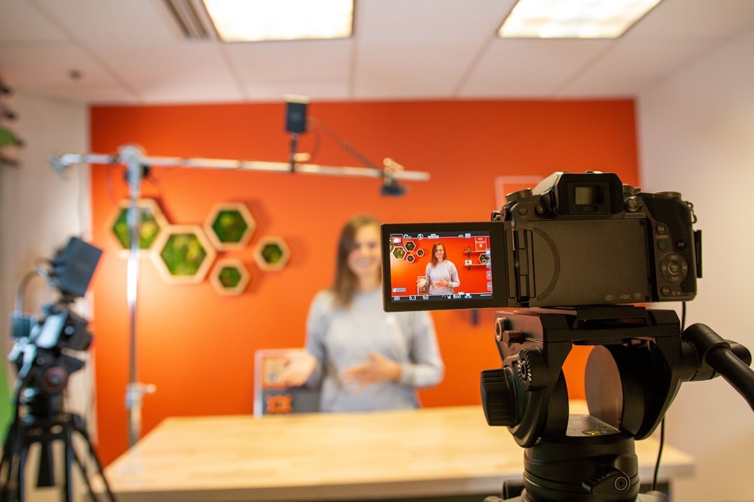 Video journalism workshop with students learning camera operation