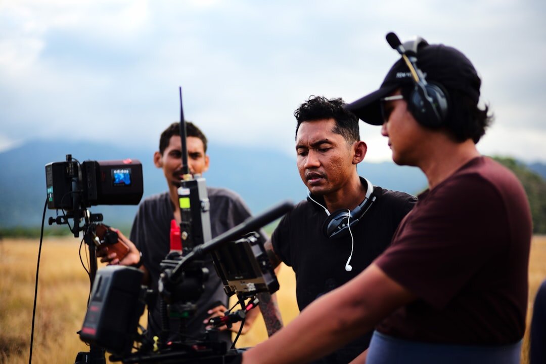 Student operating professional video camera during field journalism training