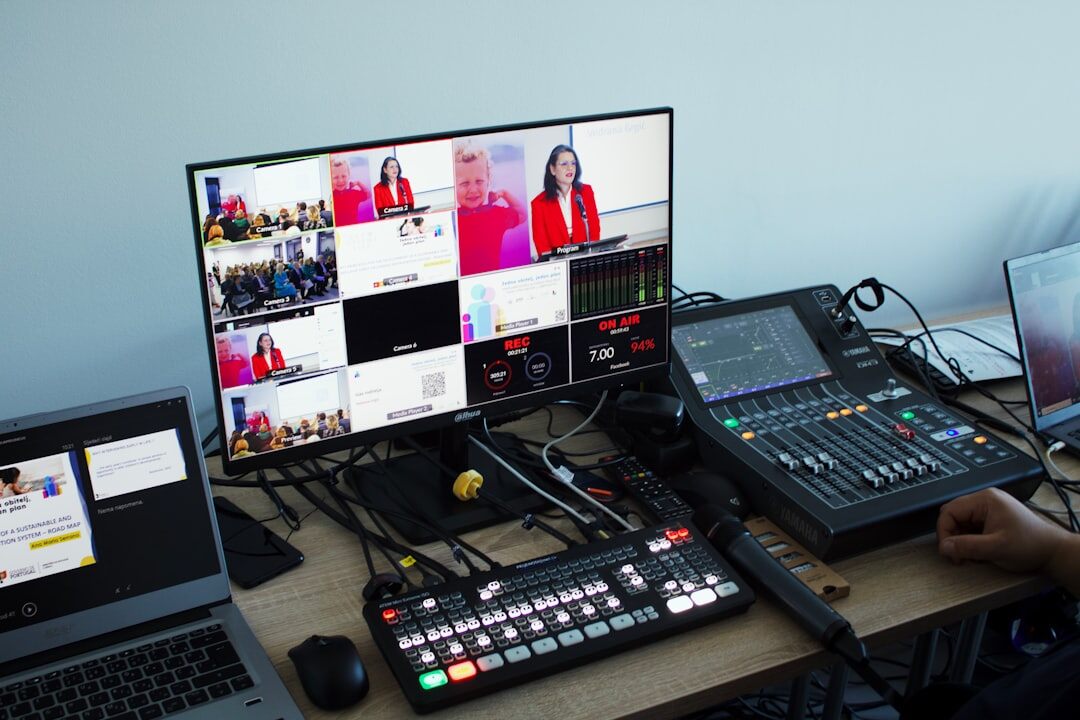 Video editing workstation with news footage on multiple screens